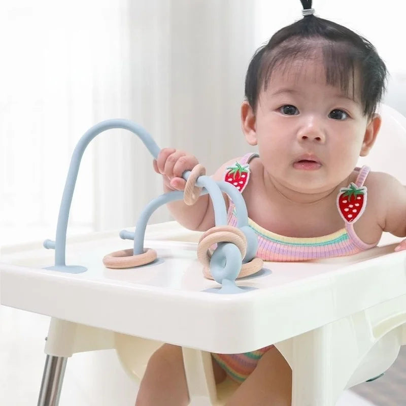 Anneaux sensoriels en bois et silicone pour chaise haute